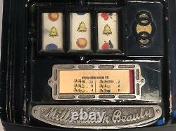 Antique Mills Black Beauty slot machine face